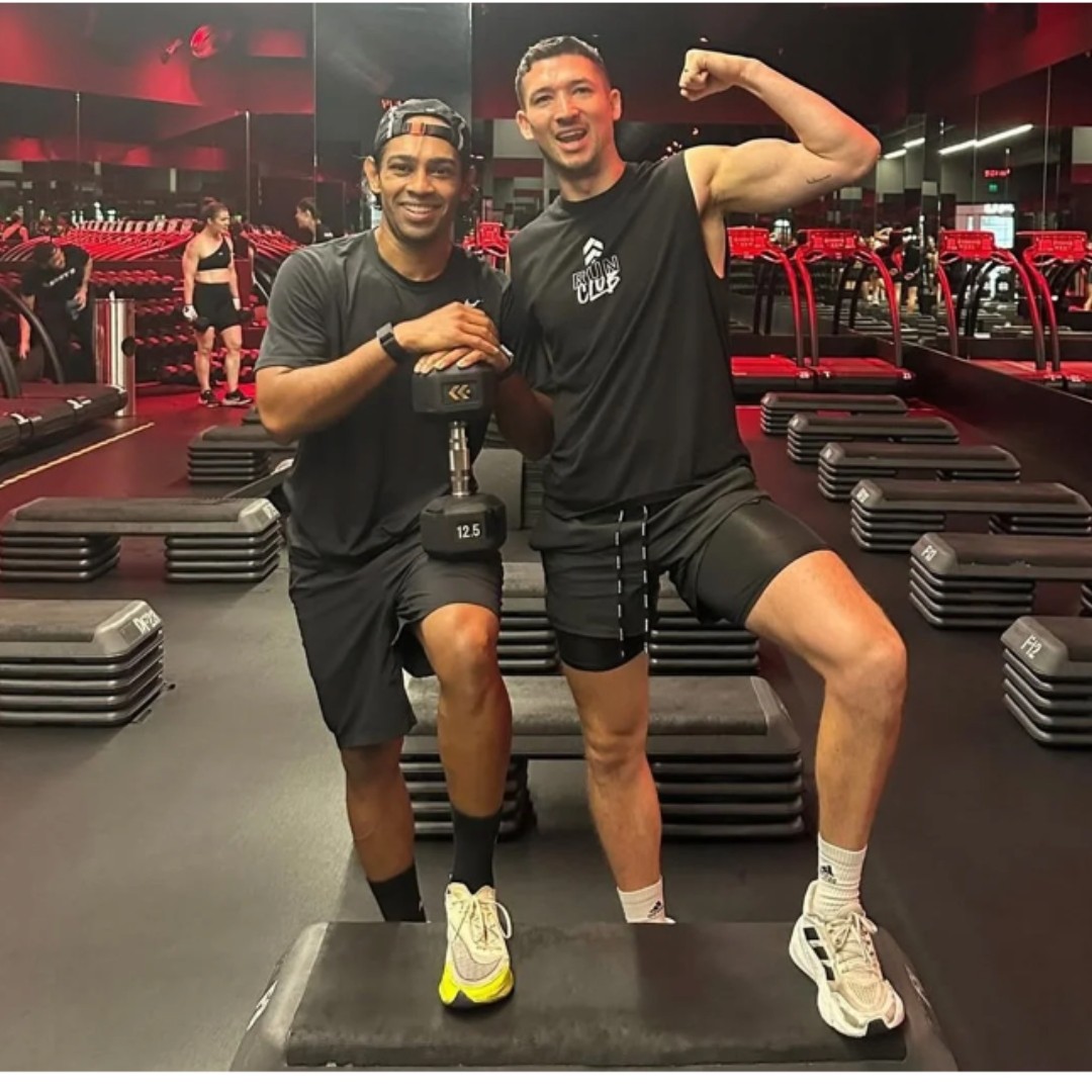 Connor with a client at the gym